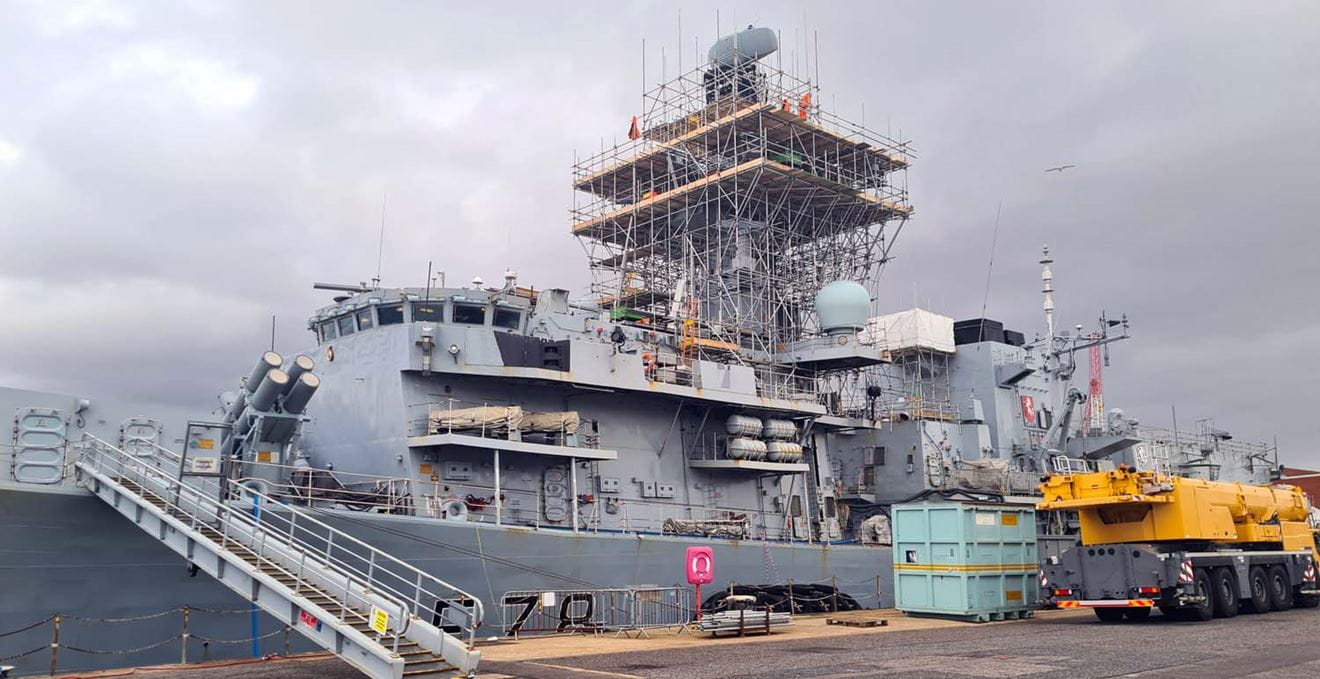 A tower of scaffolding around the main mast while engineers upgrade Kent's Artisan radar