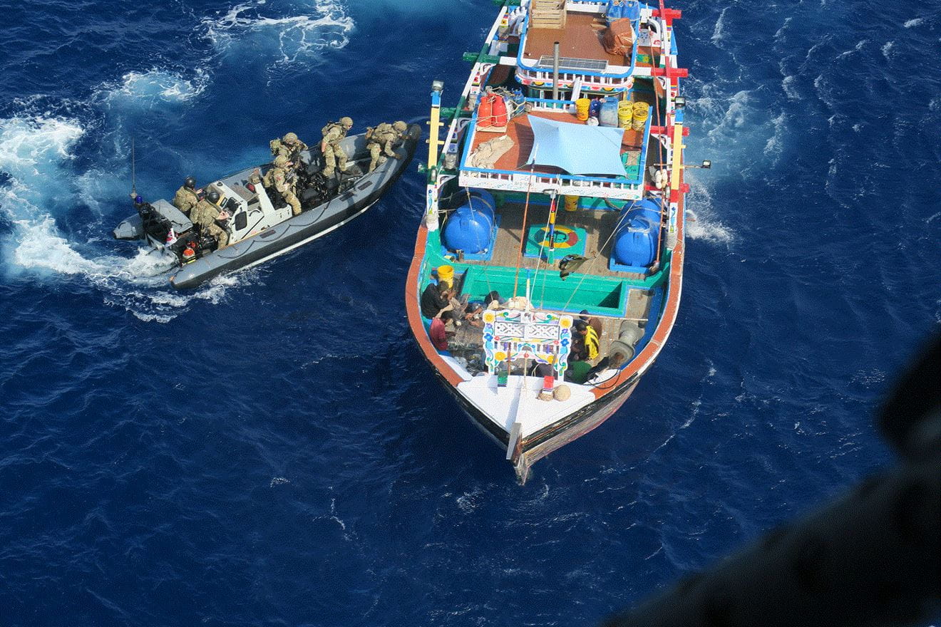 Lancaster's Wildcat provides cover as the boarding team clamber on to the dhow in the first bust