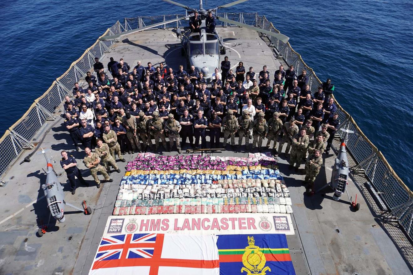 Lancaster's sailors Royal Marines Wildcat and Peregrine drones with the drugs haul on the flight deck