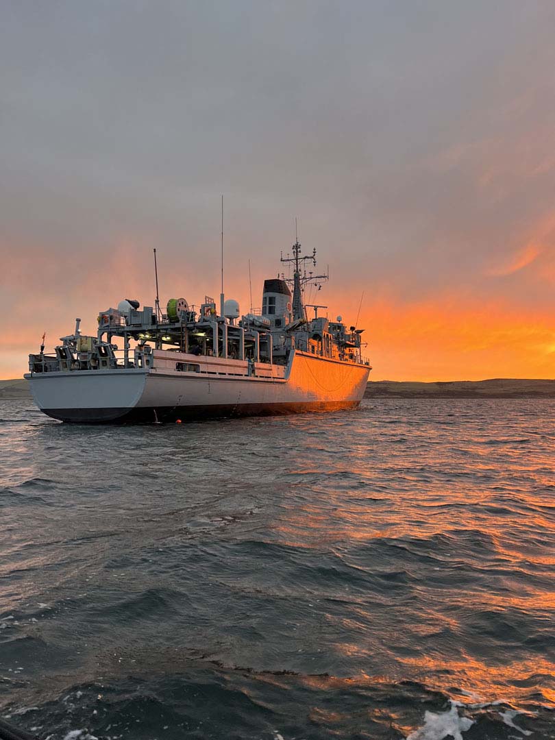 HMS Cattistock at anchor while conducting diving operations