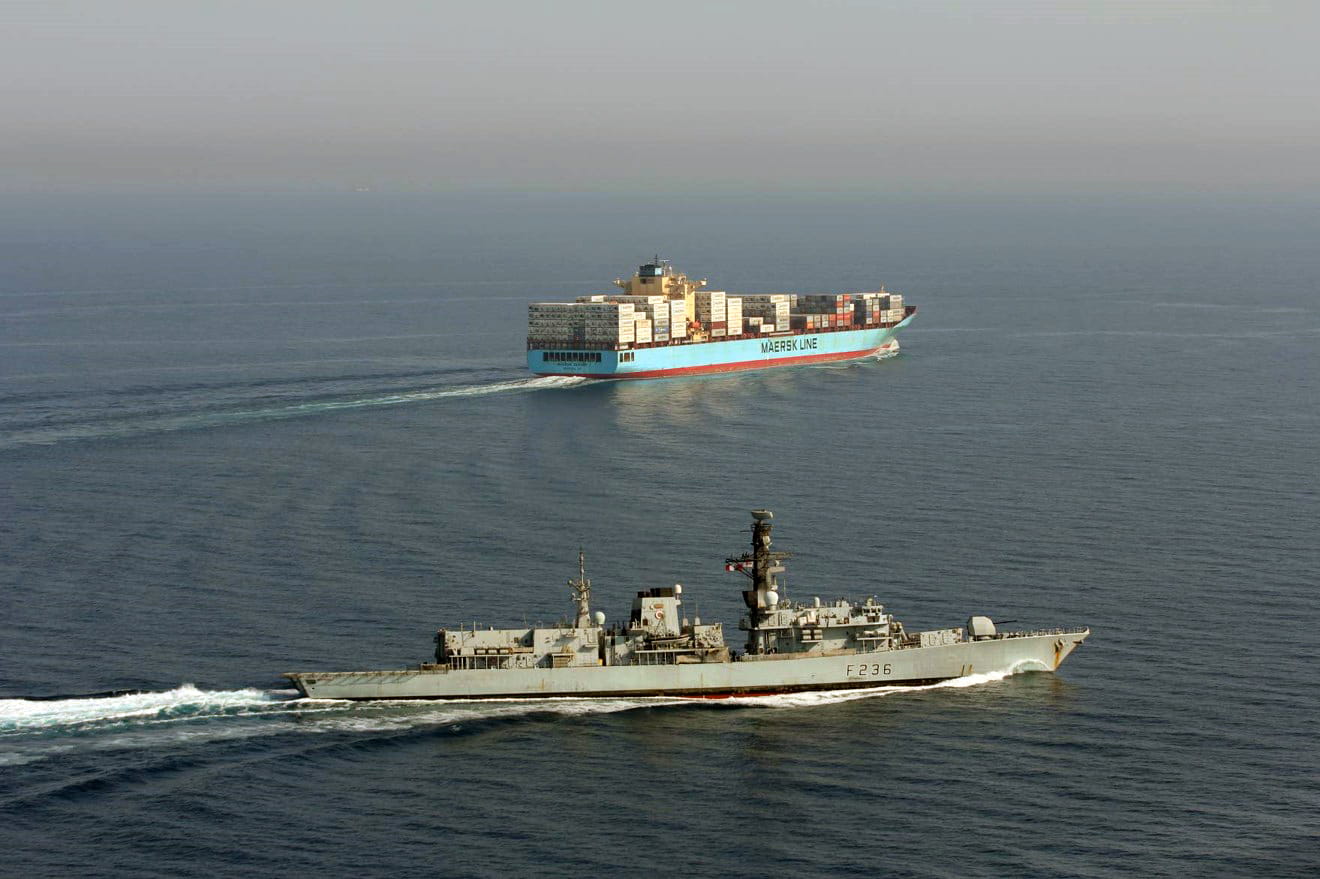 HMS Montrose shepherds a container ship in the Gulf HMS Montrose shepherds a container ship in the Gulf