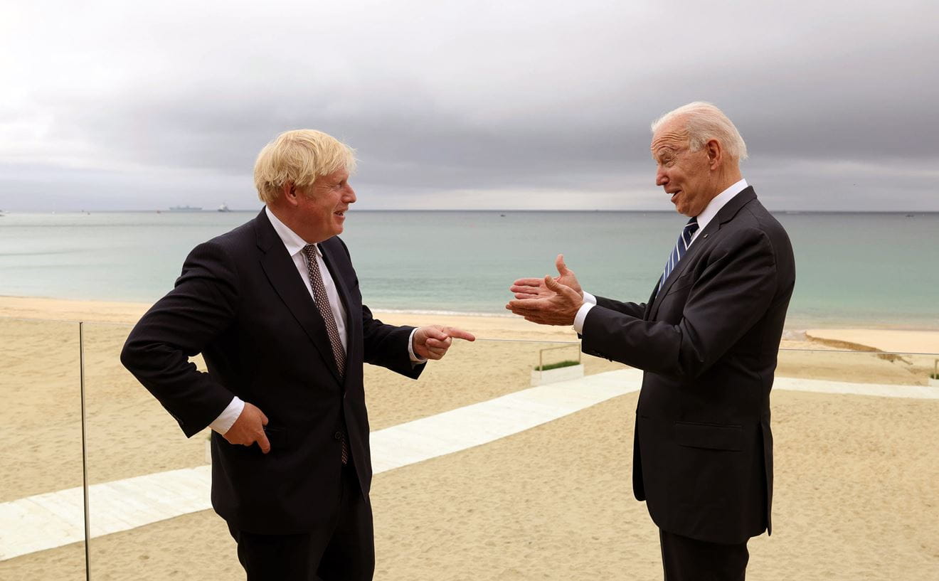 Boris Johnson and Joe Biden on the beach in Cornwall with HMS Prince of Wales on the horizon Boris Johnson and Joe Biden on the beach in Cornwall with HMS Prince of Wales on the horizon