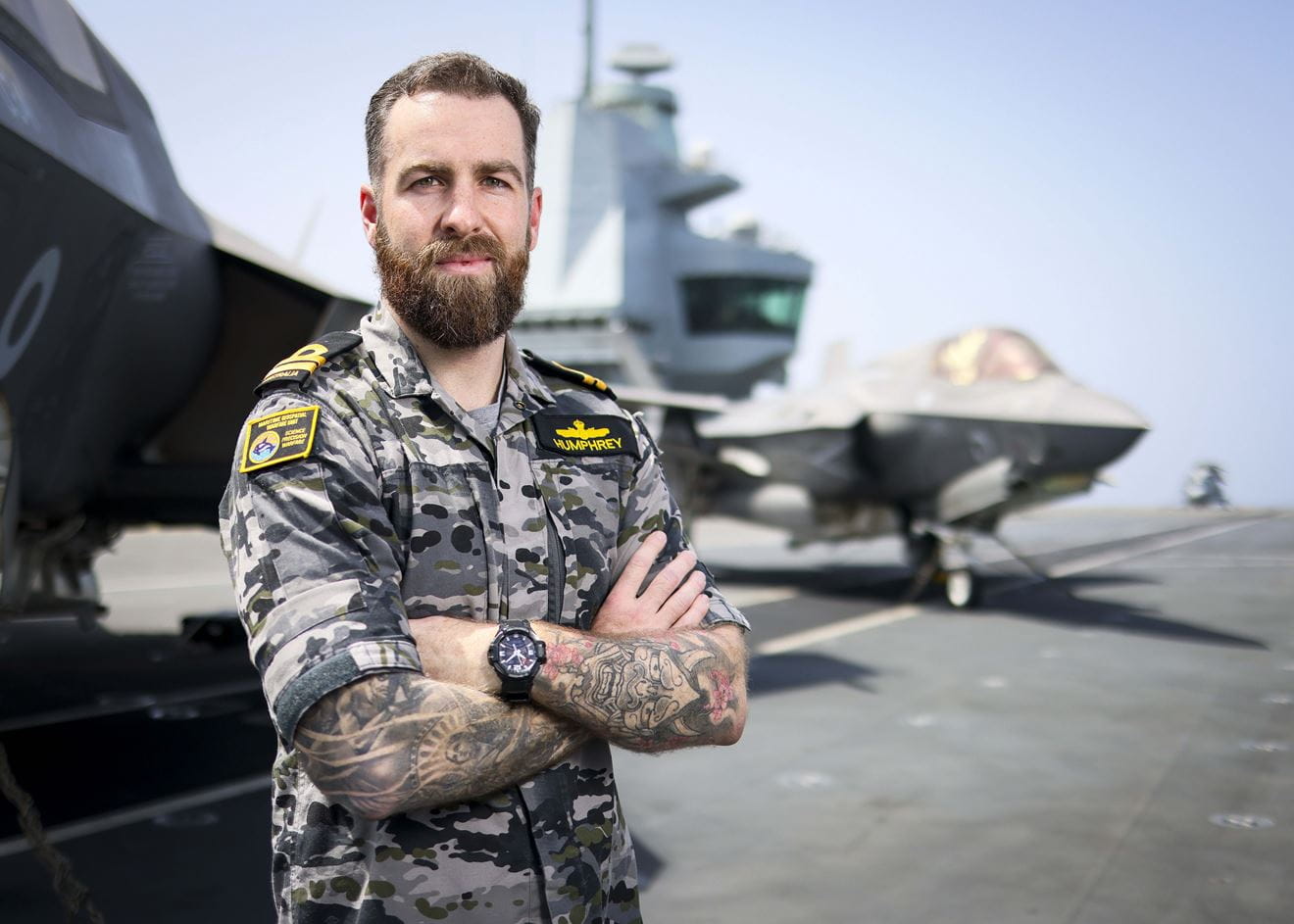 Portrait of Australian Meteorology and Oceanography Officer LEUT Liam Humphrey posing in MET Office onboard HMS Prince of Wales. This was taken on 04 June 2025.