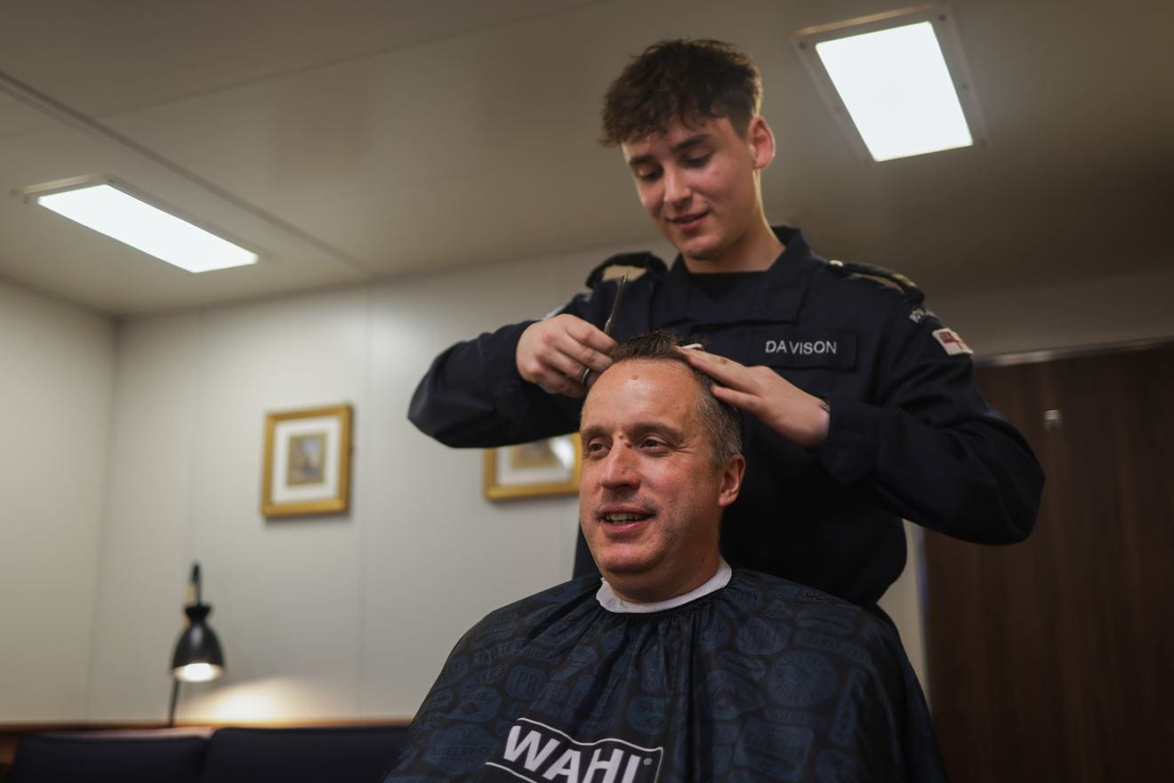 Commodore James Blackmore receives a Finn trim in his cabin aboard HMS Prince of Wales Commodore James Blackmore receives a Finn trim in his cabin aboard HMS Prince of Wales