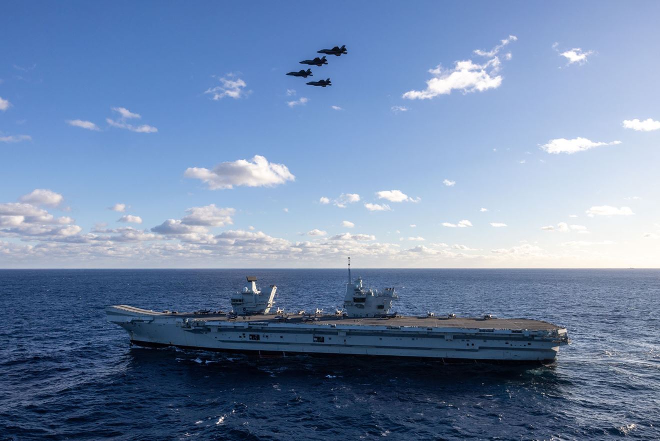 Four Lightnings stage a flypast after departing HMS Prince of Wales for the last time
