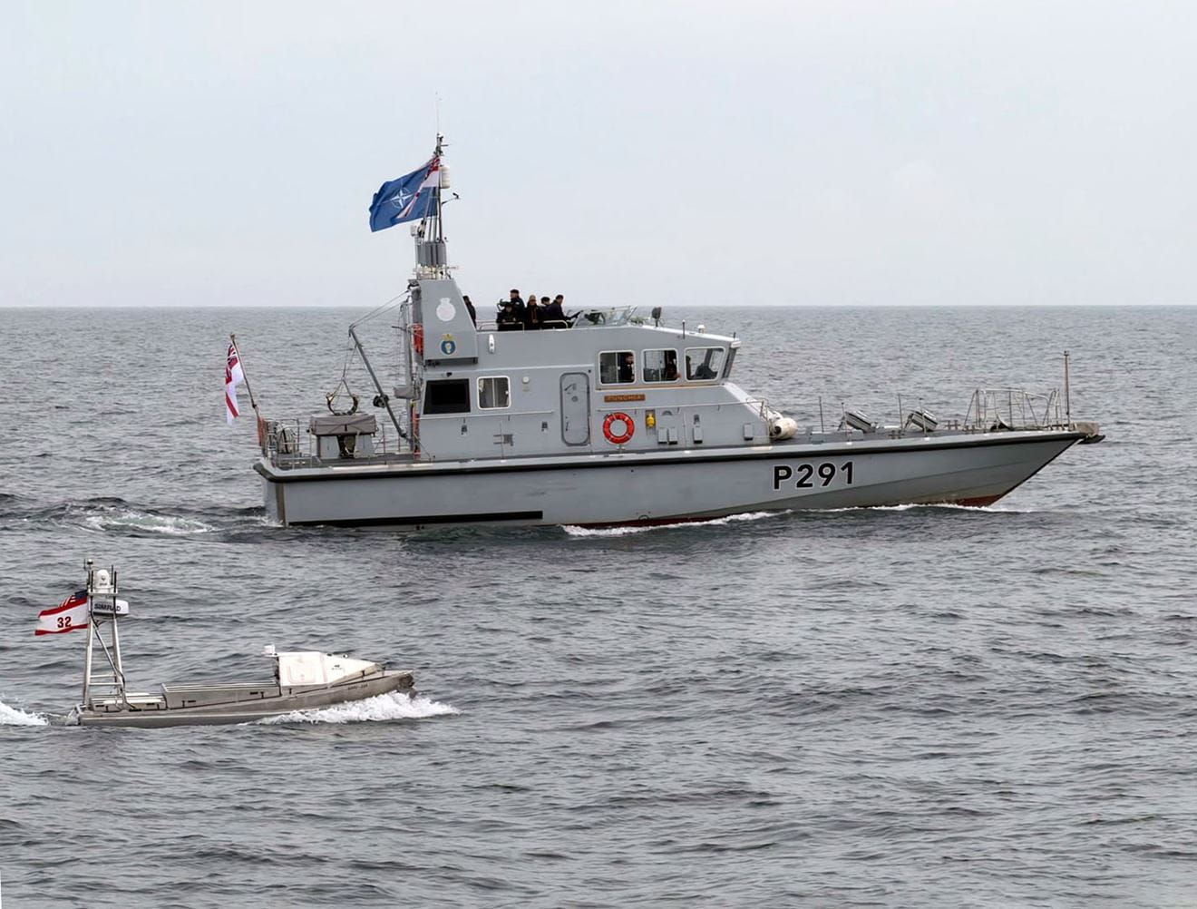 HMS Puncher sails in company with a US Navy GARC boat