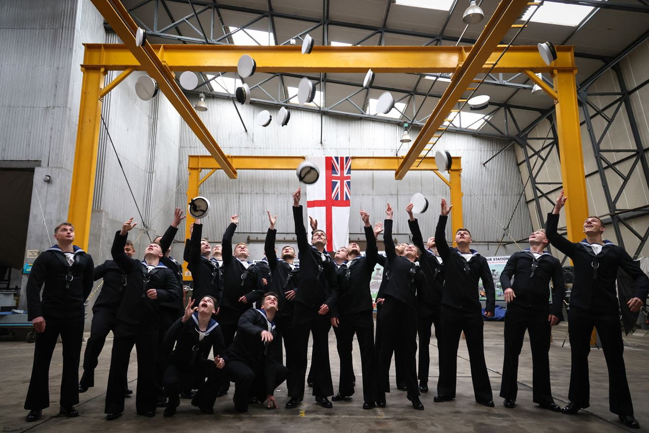 The newly-qualified Aircraft Handlers celebrate passing out from Culdrose