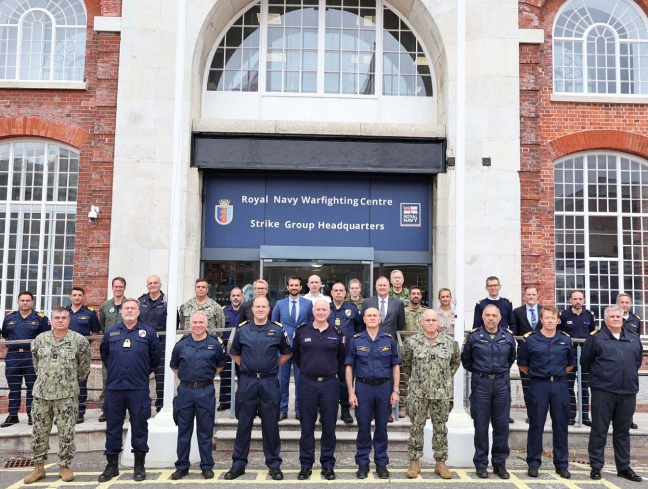 NATO contingent stood outside the Warfighting Centre in Portsmouth as part of meeting hosted by Rear Admiral Rob Pedre
