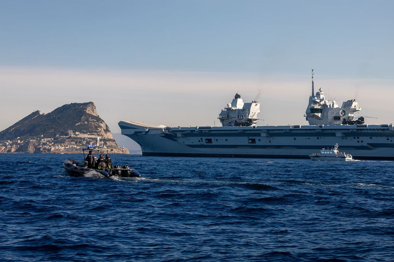 HMS Cutlass and a police launch meet up with HMS Queen Elizabeth off Gib