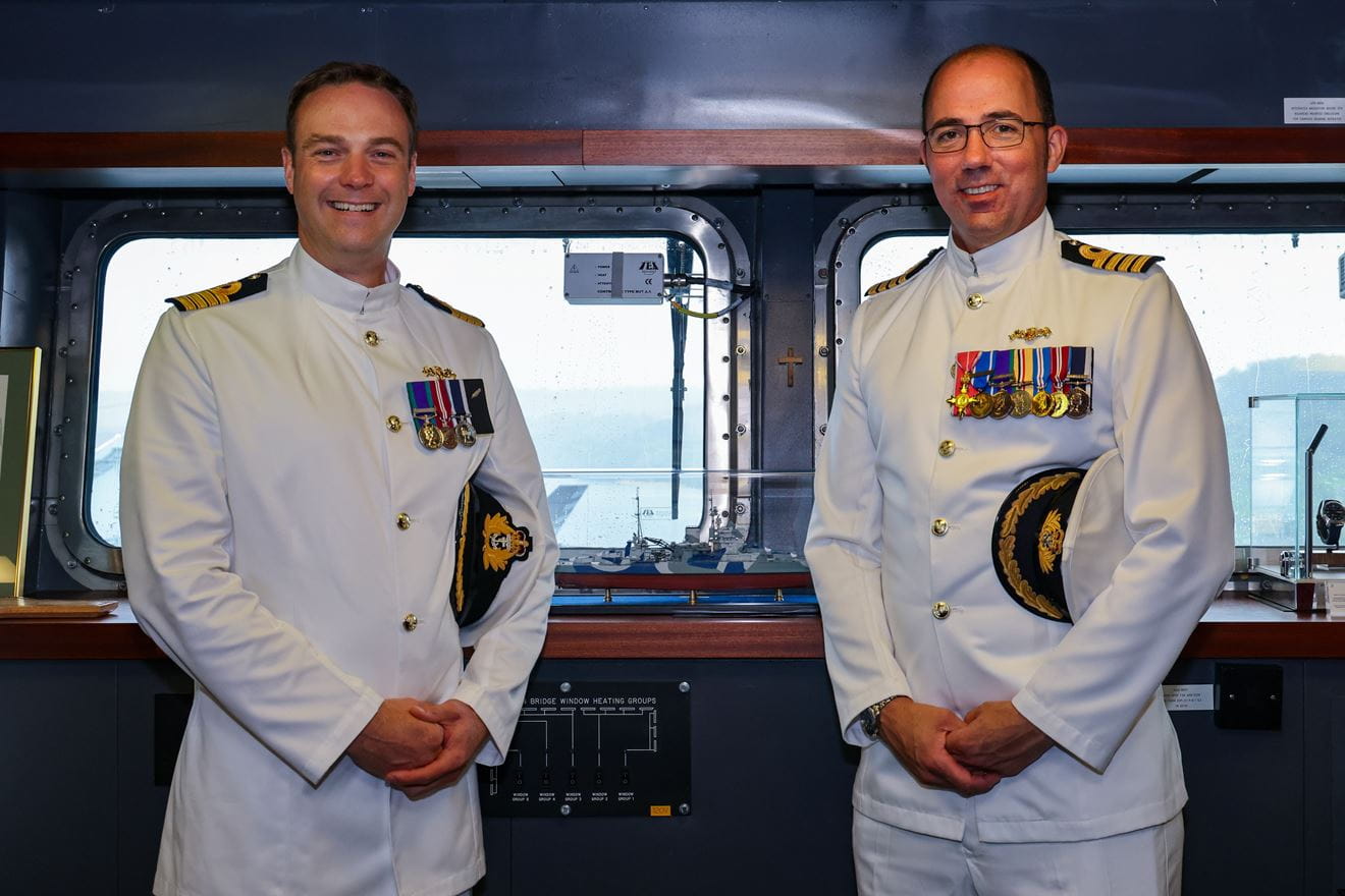 Captain Ian Feasey has taken over Captain Angus Essenhigh as commanding officer of HMS Queen Elizabeth. Picture: POPhot Jay Allen