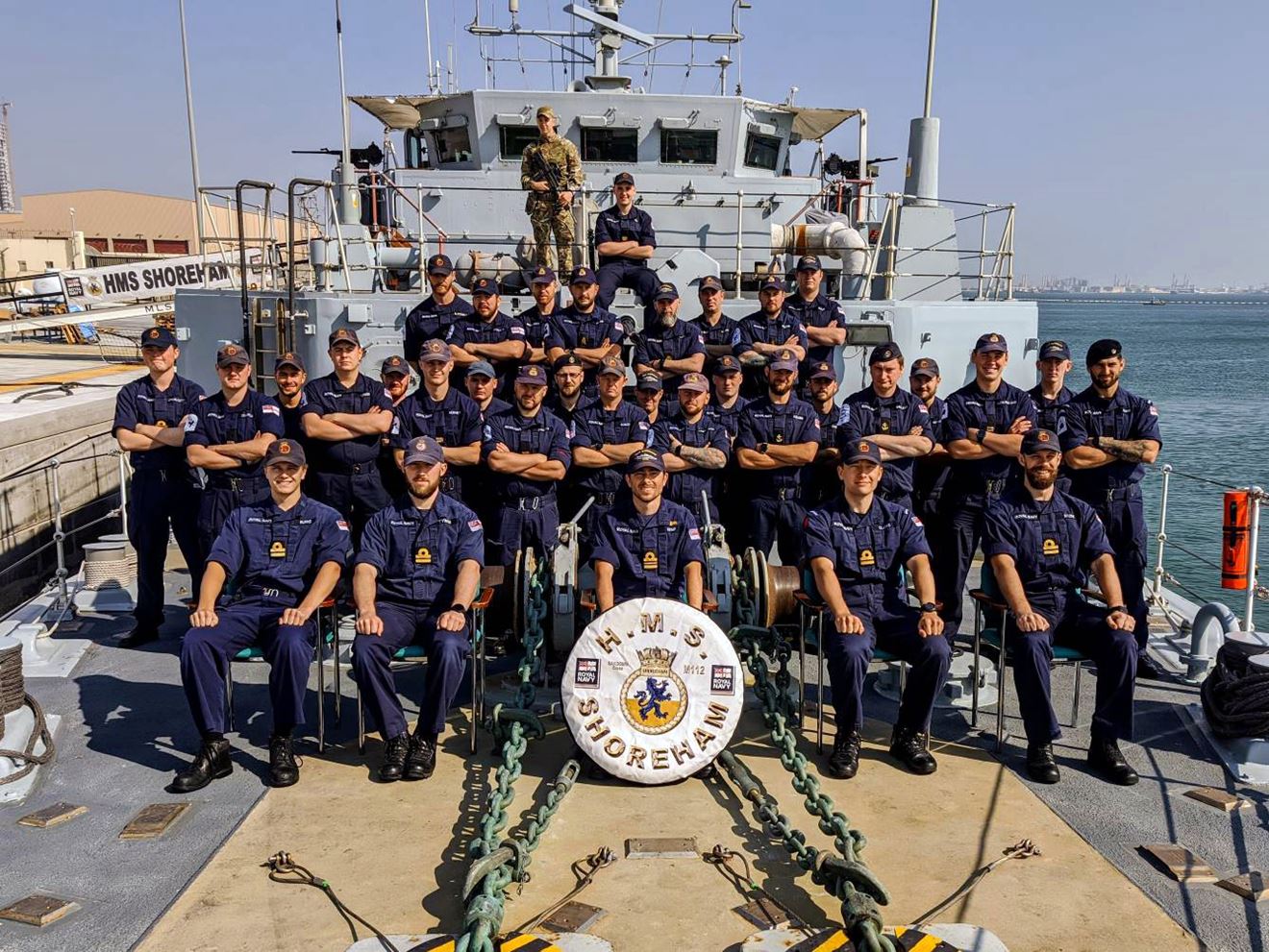 HMS Shoreham Crew 5 pose on the forecastle HMS Shoreham Crew 5 pose on the forecastle