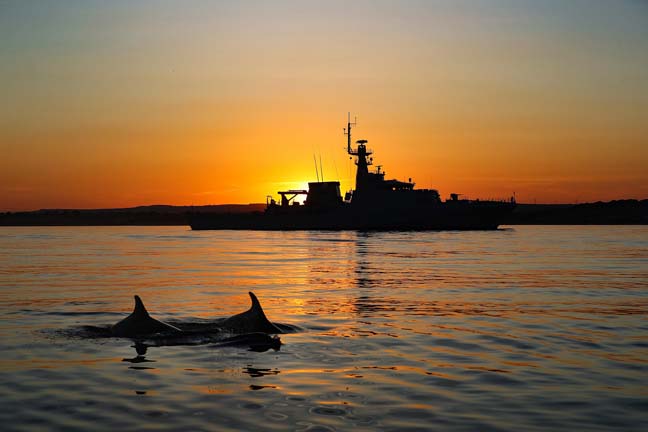HMS Tamar raises her flag on her own river