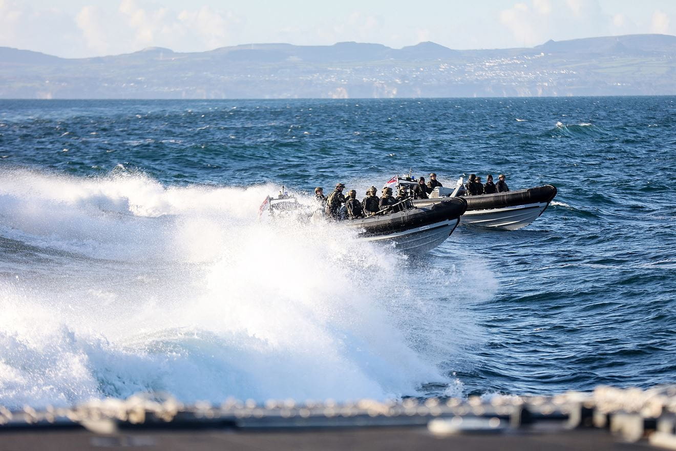The boarding and search team races through Plymouth Sound at high speed in two RIBs