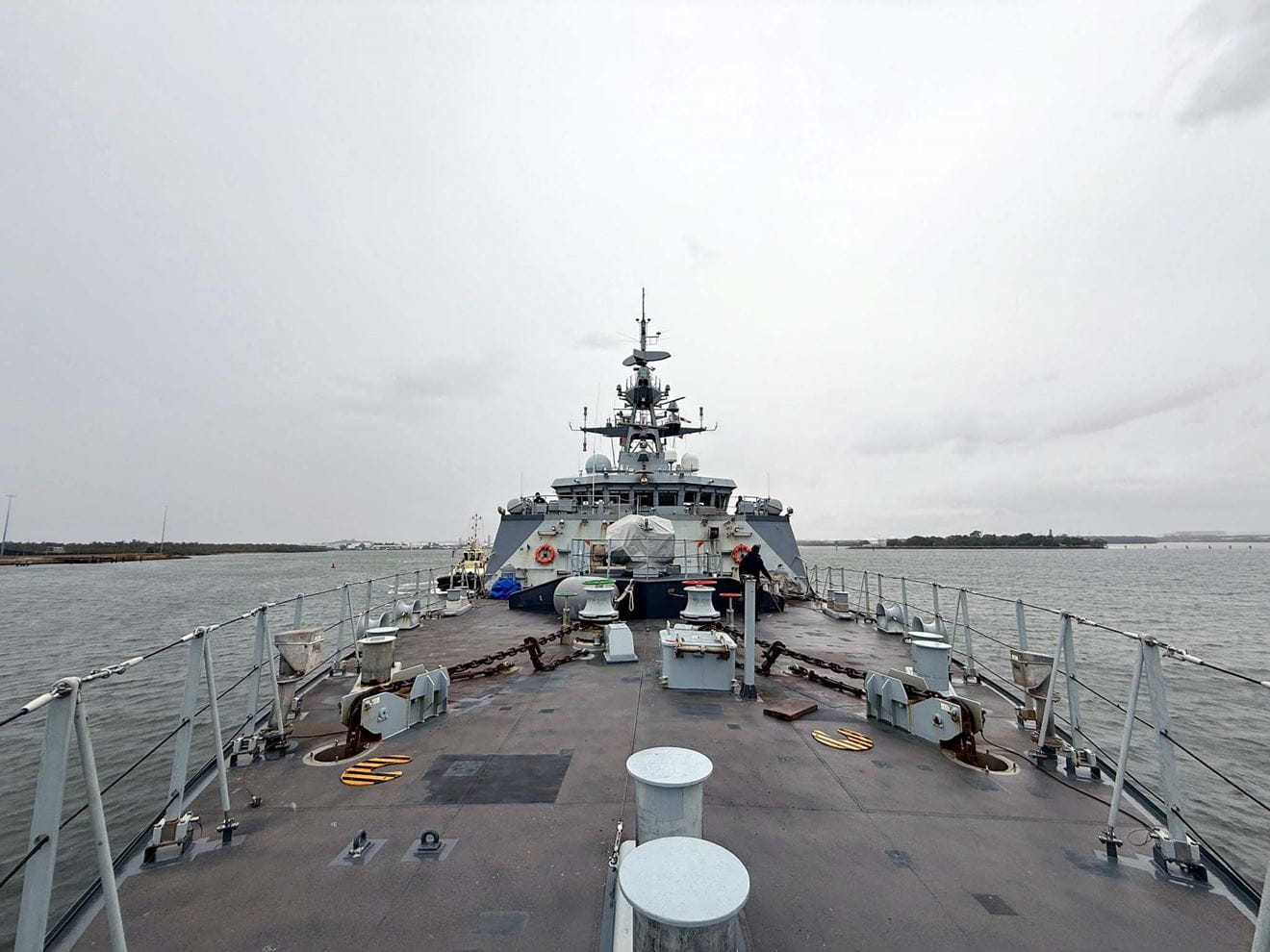 A view down the forecastle as HMS Tamar leaves Brisbane