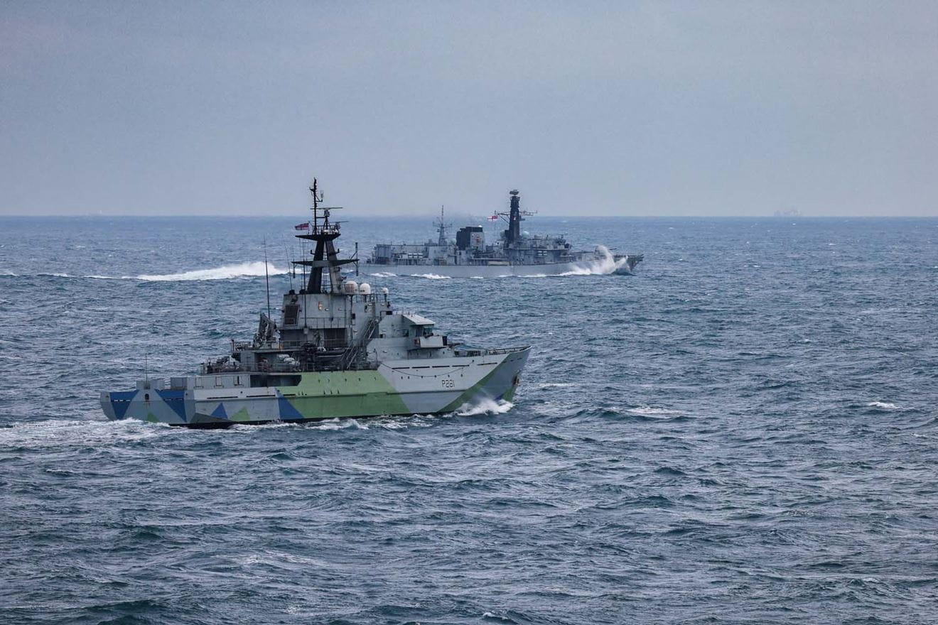HMS Tyne foreground with frigate HMS Iron Duke shadowing Russian vessels in the Channel in February