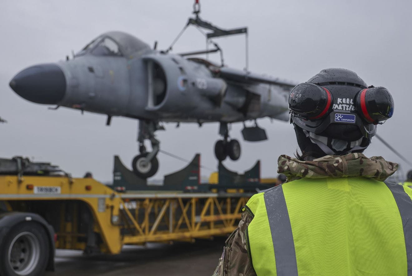 The partially-disassembled Sea Harrier is lifted for loading on to a low-loader at RNAS Yeovilton The partially-disassembled Sea Harrier is lifted for loading on to a low-loader at RNAS Yeovilton