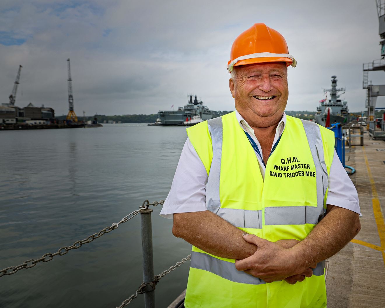 Wharfmaster Dave Trigger with tugs in the background manoeuvring HMS Albion Wharfmaster Dave Trigger with tugs in the background manoeuvring HMS Albion
