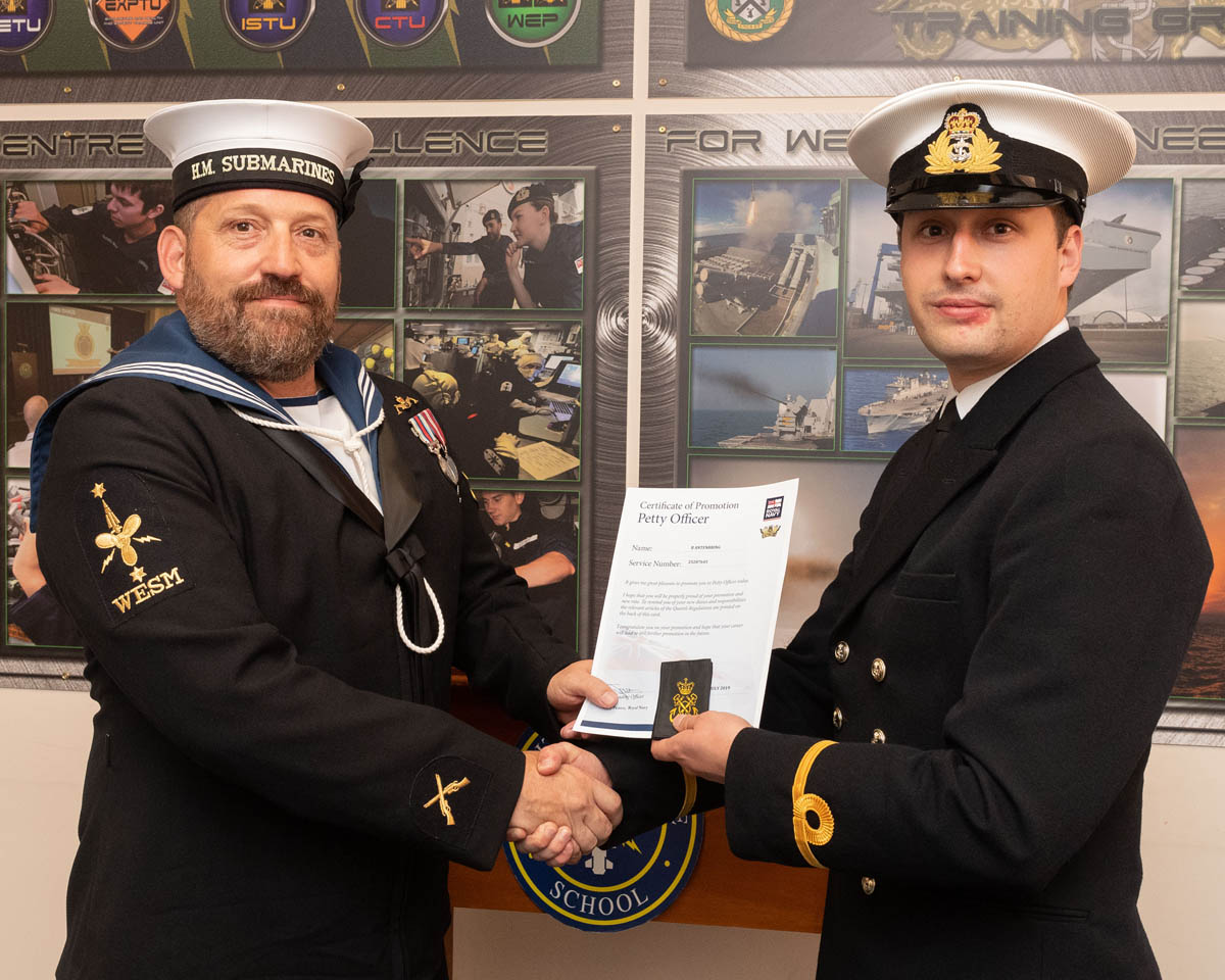 Son 'promotes' father in unique ceremony