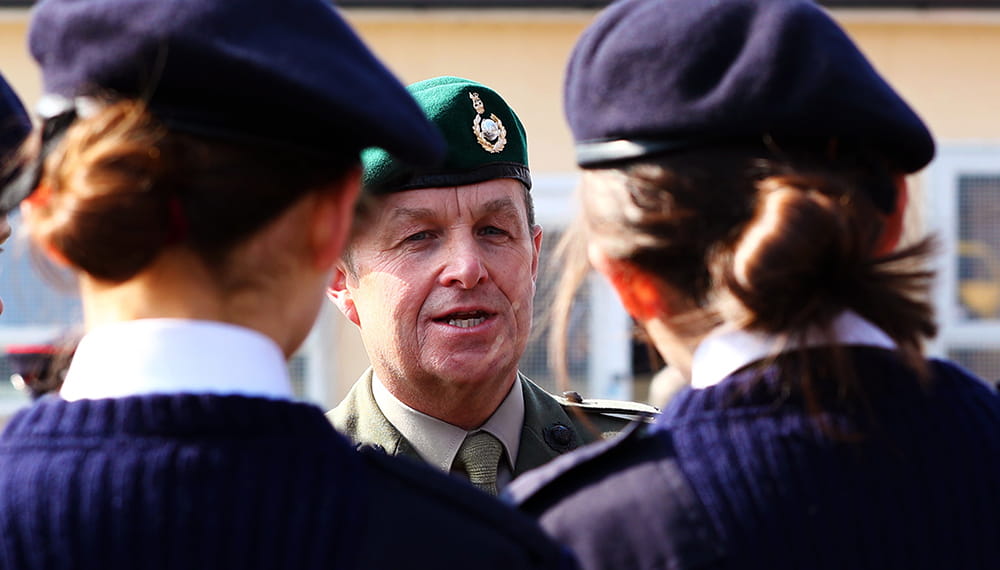 Two Royal Navy cadets facing Army Major