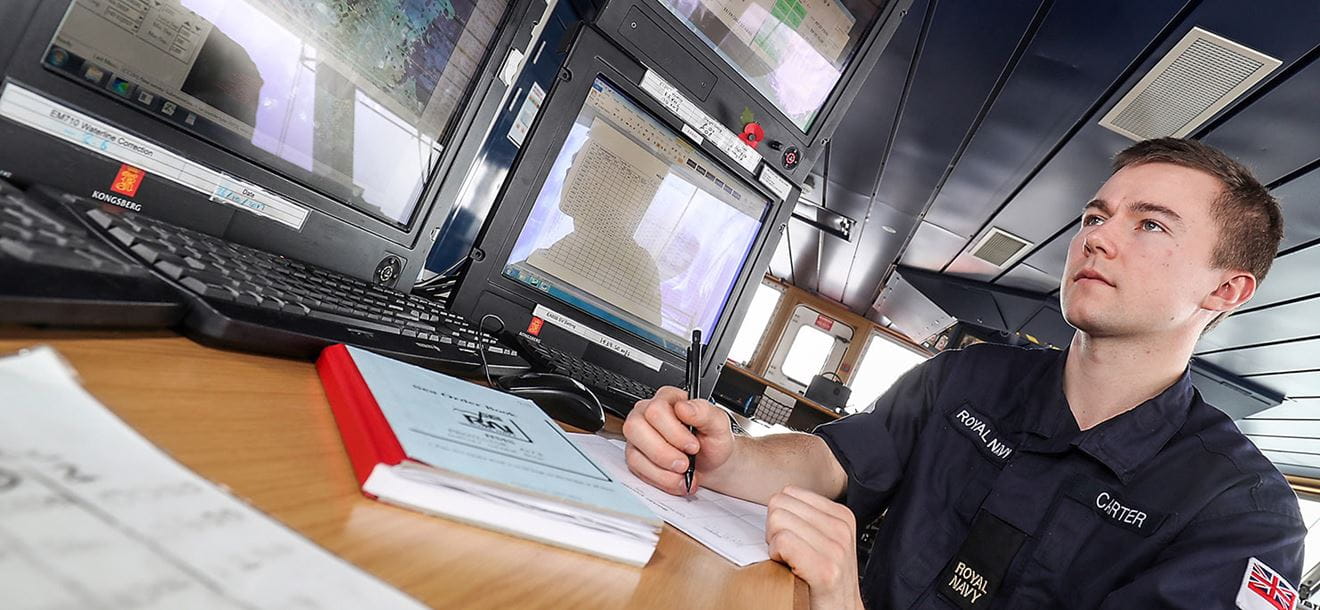 Able Seaman Hydrographer Joe Carter gathering information from the multibeam echo sonar in search of the missing submarine