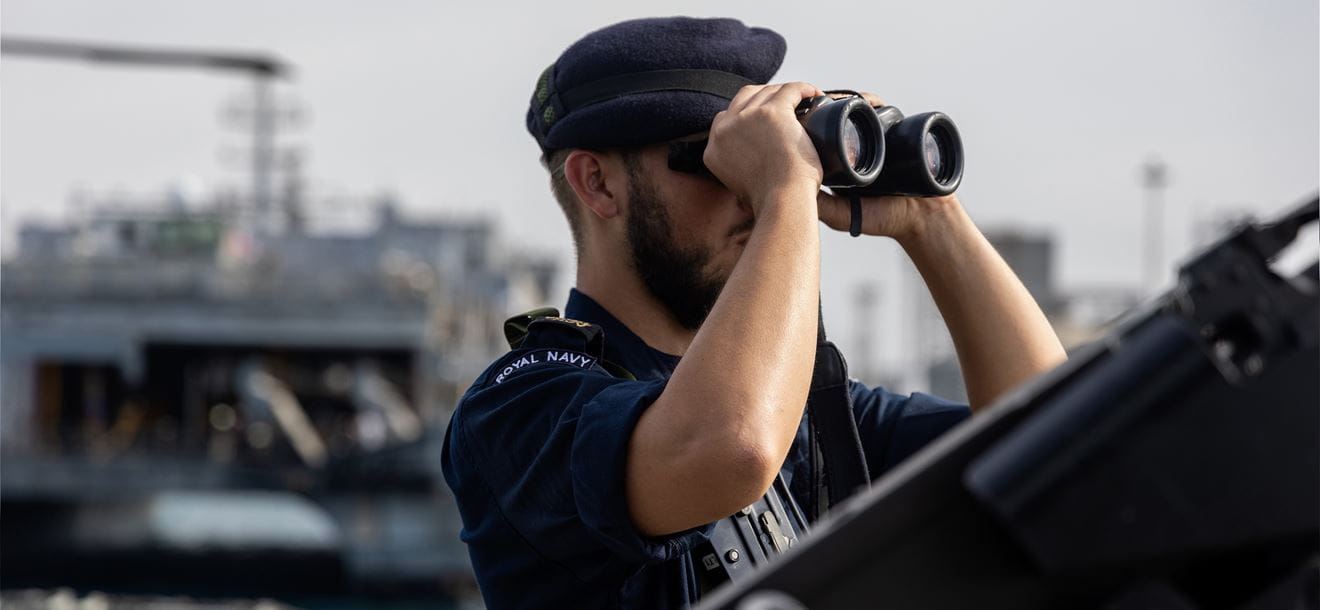 A SAILOR KEEPS WATCH ONBOARD HMS LANCASTER.
