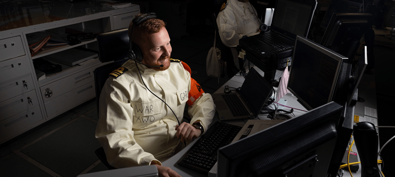 Principal Warfare Officer Air (AWO) at work in the Ops Room onboard HMS Prince of Wales, as the UK Carrier Strike Group transits the Red Sea, 31 May 2025.