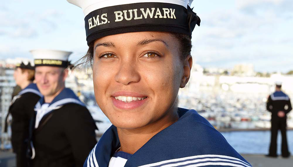 Royal-Navy-Our-People-Ops-for-all-02-inclusive Female Royal Navy sailor smiles at camera