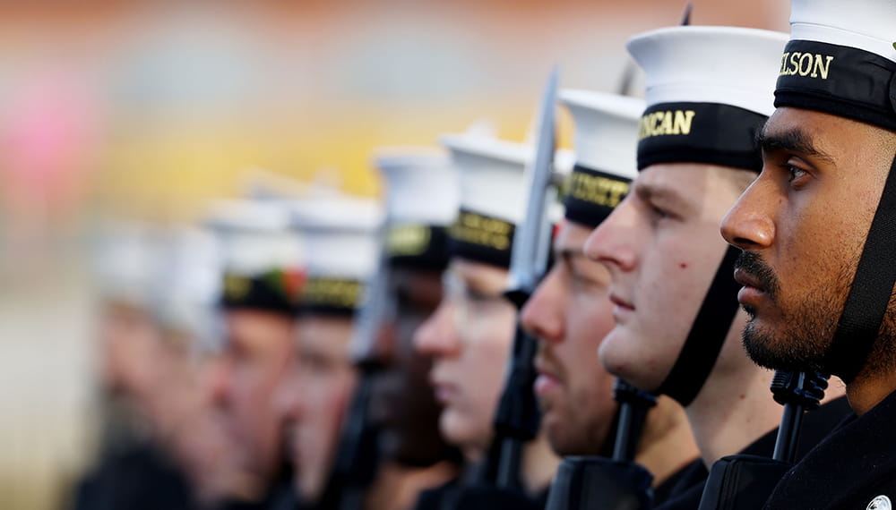 Royal-Navy-Our-People-04-opportunities.jpg Royal Navy sailors in ceremonial uniforms stand in line
