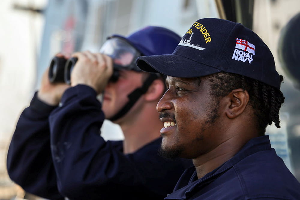 Royal-Navy-Our-People-Our-Values-03-invest.jpg Royal Navy chef looks out from the bridge of HMS Defender