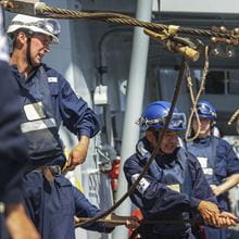 Royal-Navy-Our-People-Our-Values-19-learning.jpg RFA sailors pulling on lines during replenishment at sea operation