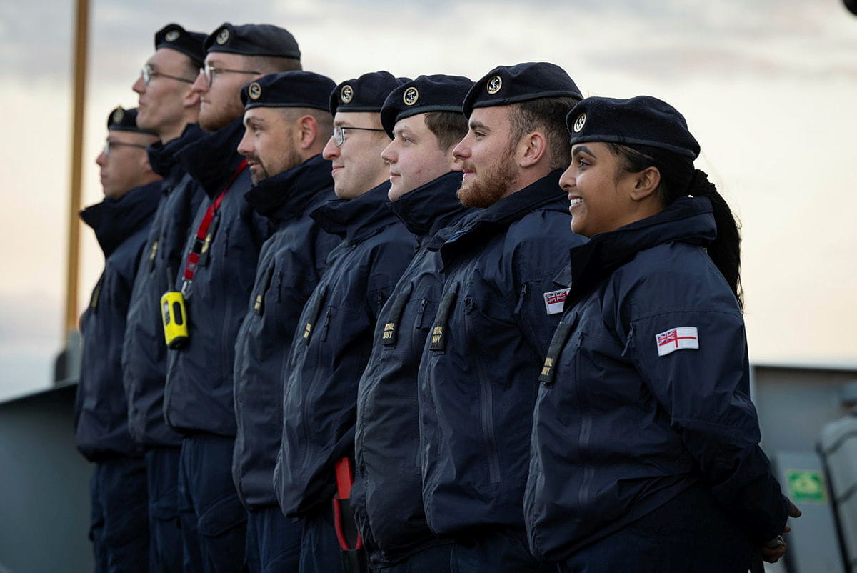 Image of eight Naval Reservists standing in a row