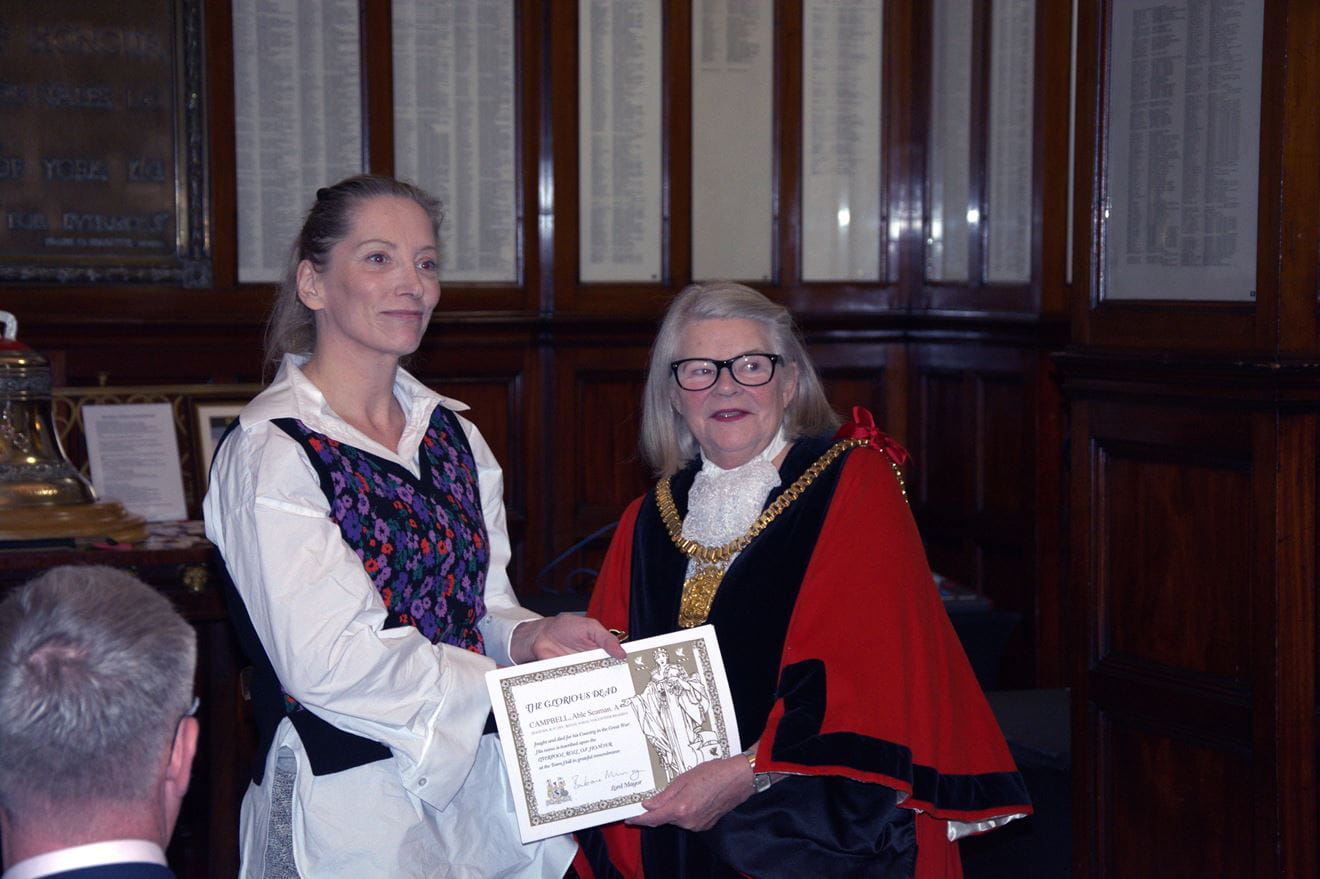 CPO Steve Calderbank, Chairman of HMS EAGLET Old and Bold Affiliation receiving a scroll for Alexander Mould