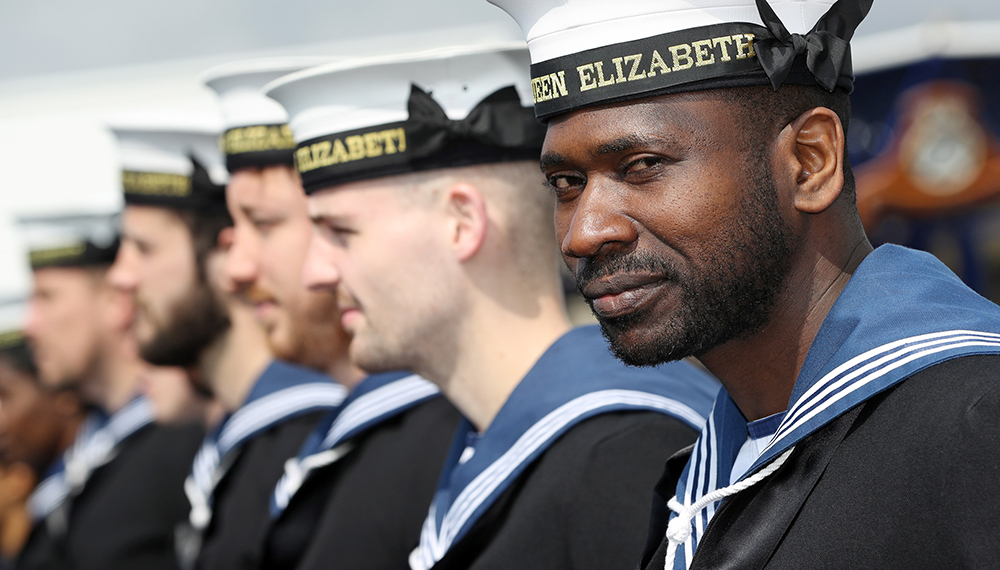 Royal-Navy-What-we-do-Respond-03-maintaining-excellence.jpg Royal Navy sailor smiles whilst on parade