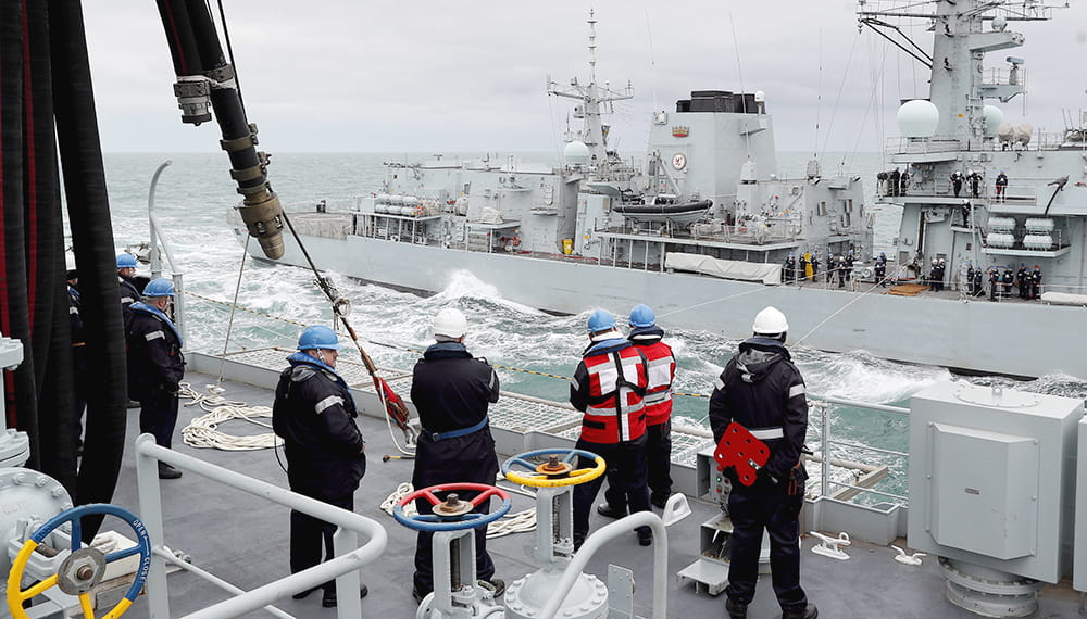RFA Tidespring conducts her first ever RAS with a Royal Navy Warship HMS Sutherland in the background