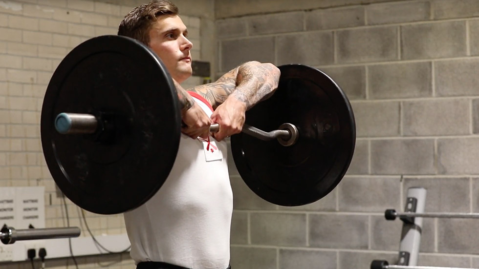 Physical instructor upright row technique