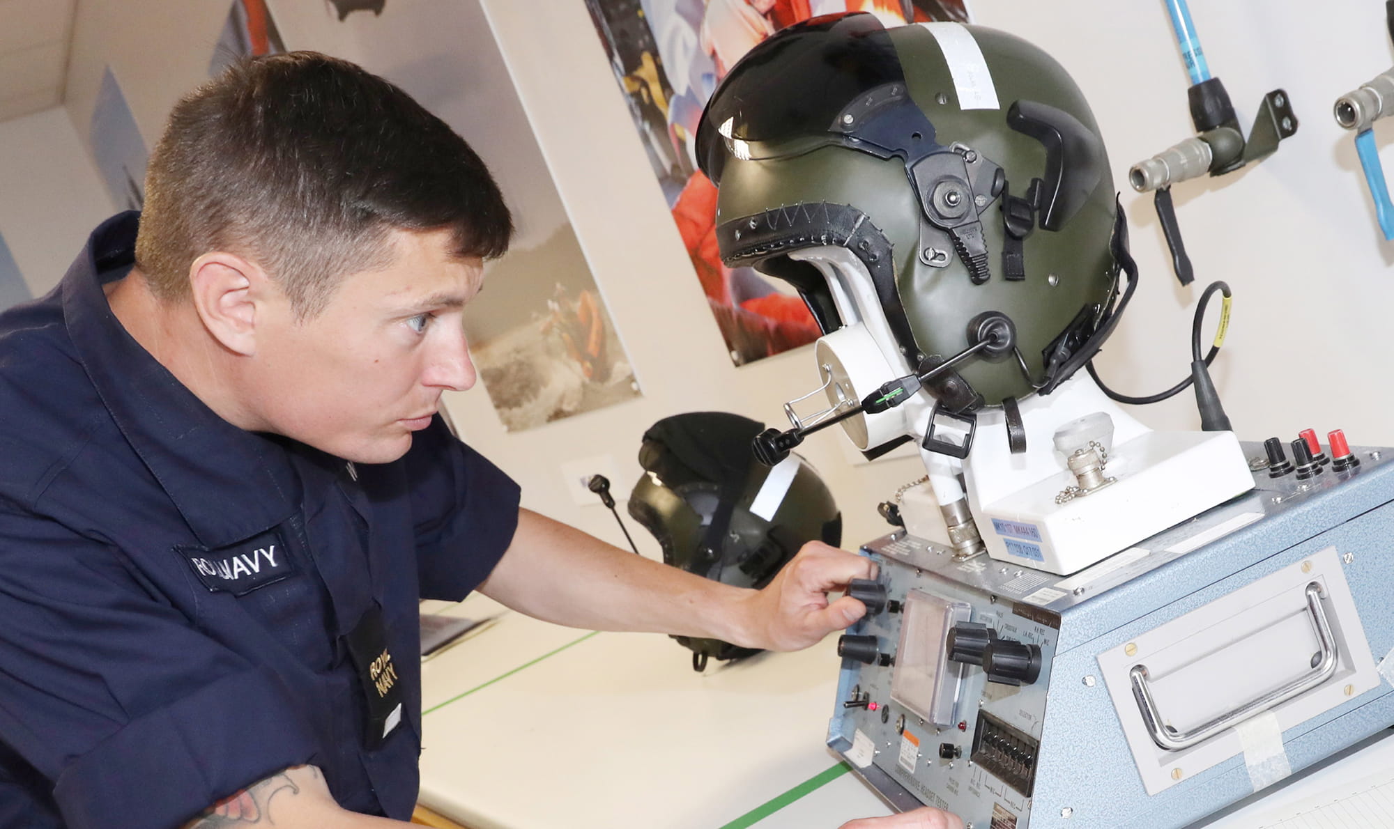 Survival Equipment Technician performing helmet testing