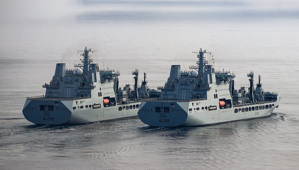 royal-navy-careers-royal-fleet-auxiliary-02 Photo of two large boats at sea. The Tide class tankers were conducting replenishment at sea trials (RAS).