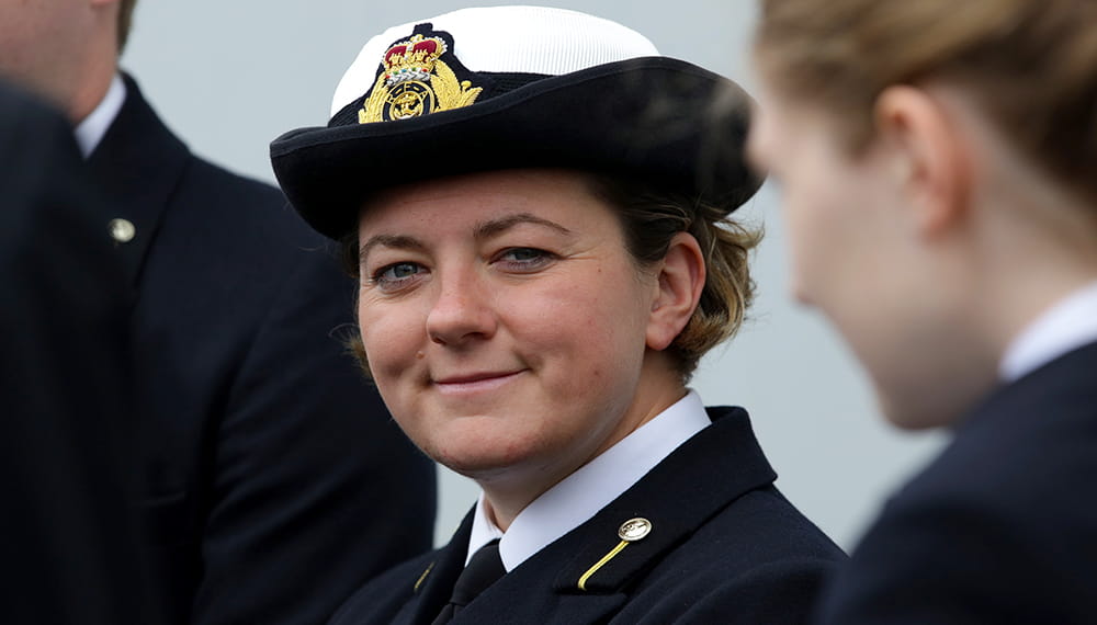 CNR officer smiles at camera. RFA Lyme Bay hosted a Livery Day to guests as part of the London Internation Shipping Week.