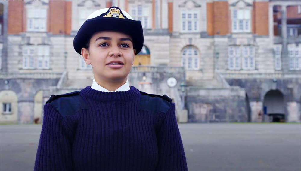 Royal Navy officer talks to the camera during an interview