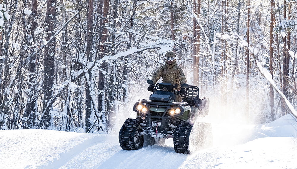 Royal Marine riding a Can-Am Outlander 6x6 ATV
