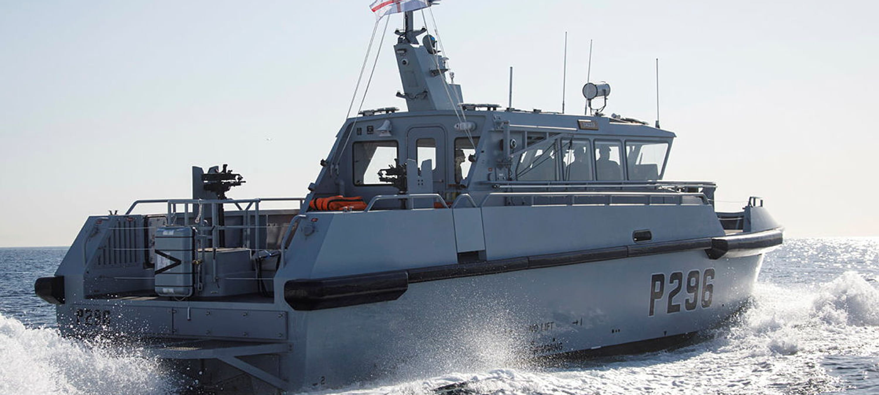 HMS Dagger at sea powering away from the camera
