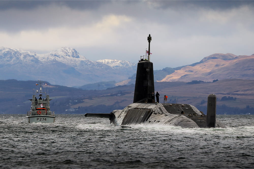 A submarine emerges out of the sea near port Clyde