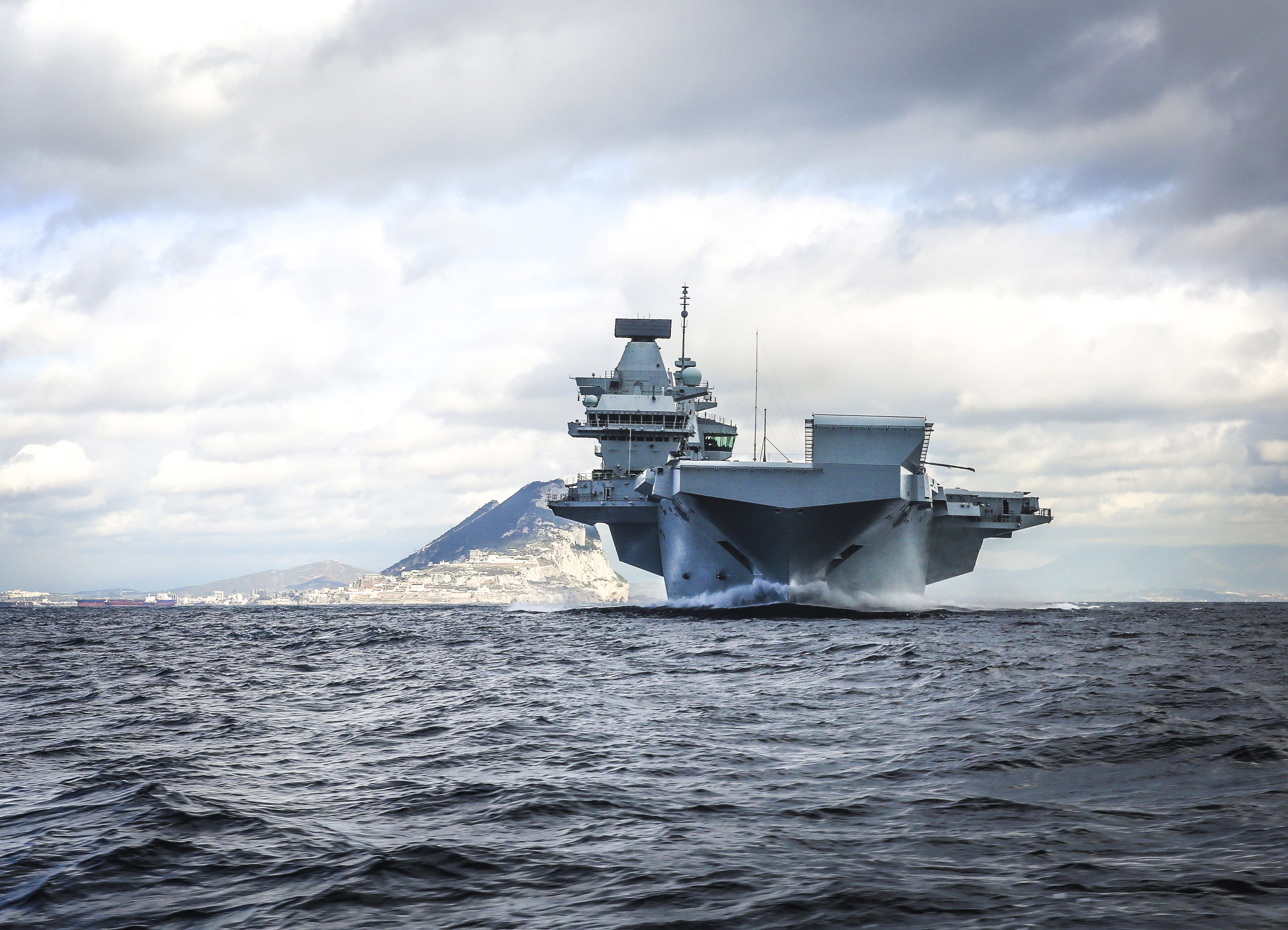 HMS Queen Elizabeth leaves the port of Gibraltar after her maiden overseas stop