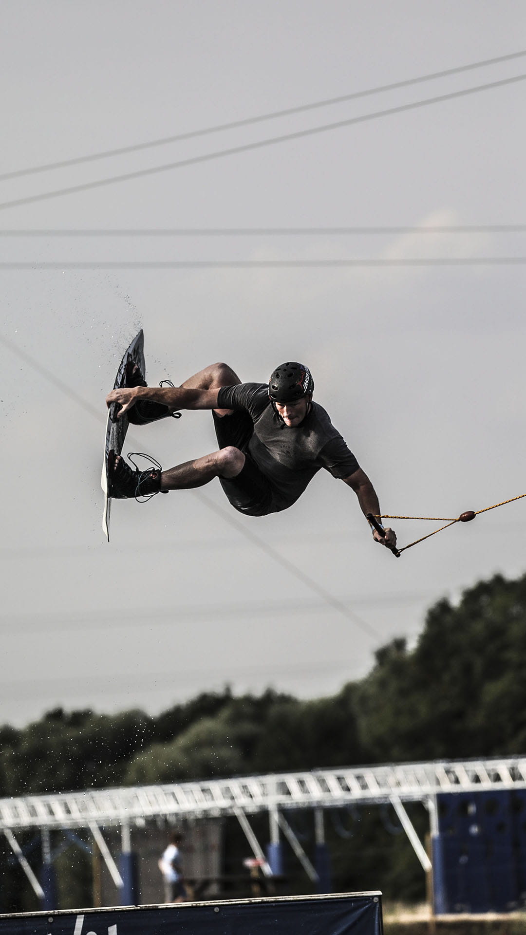 A person flying through the air while wakeboarding
