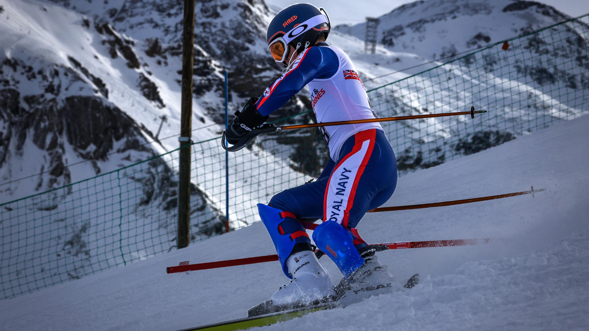 A Royal Navy sailor skiing.