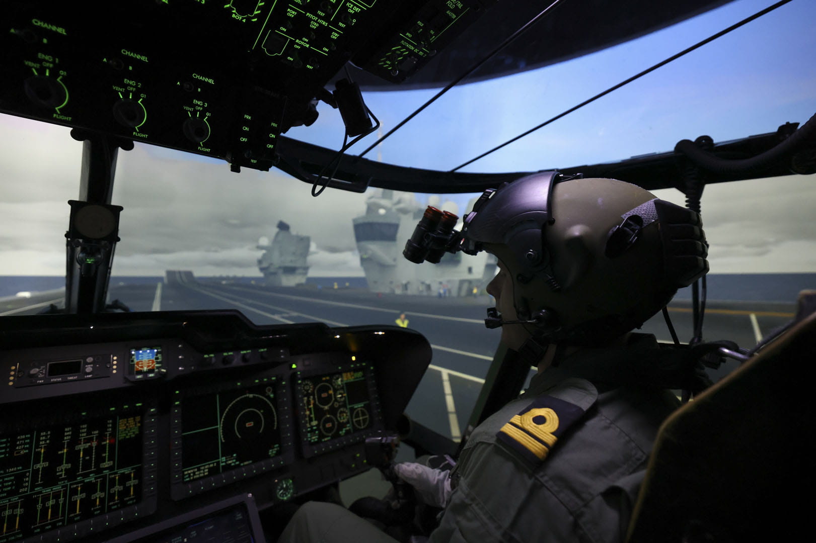 A pilot from 820 NAS practises operations from a Queen Elizabeth class aircraft carrier in one of the simulators at RNAS Culdrose