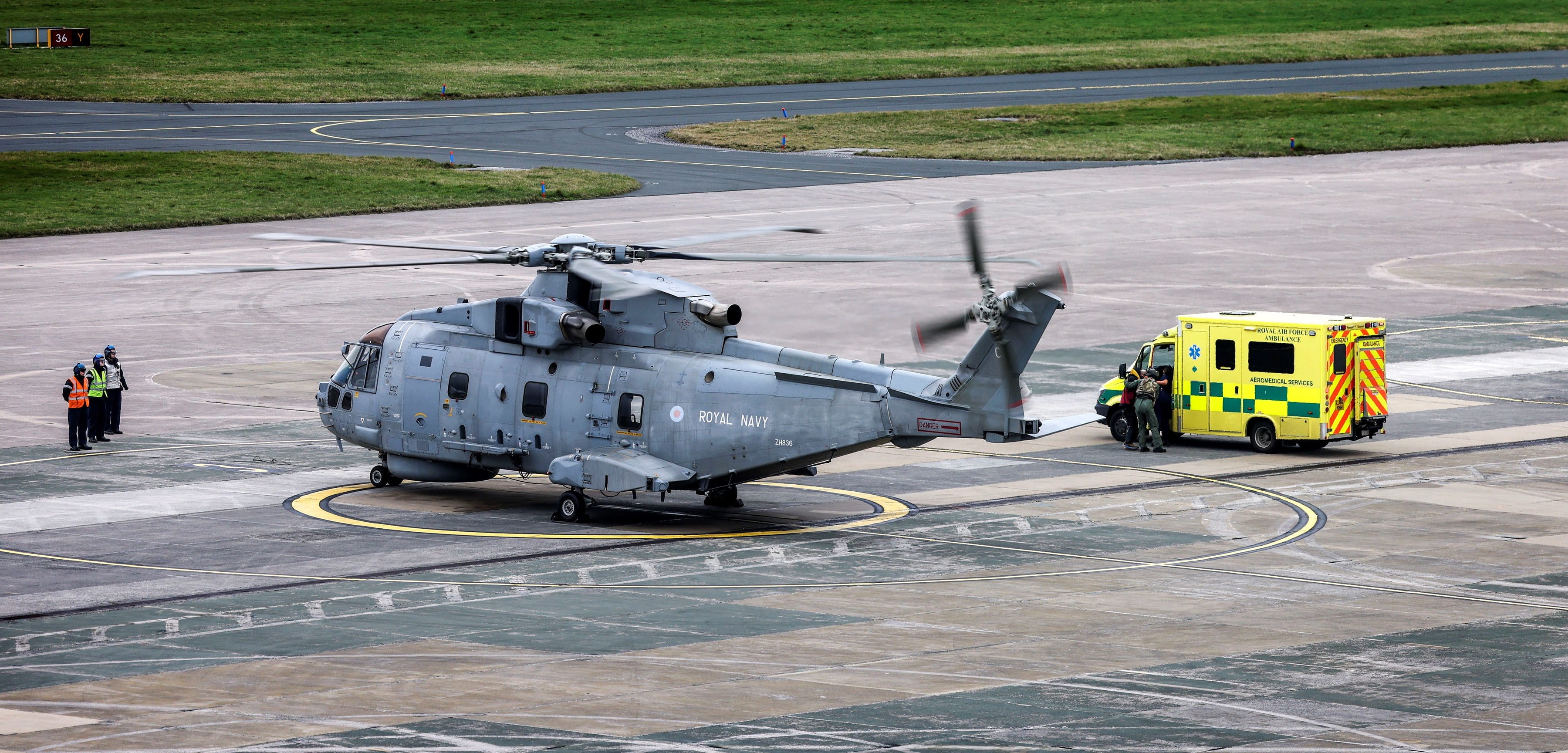 The aircrew hand over the kayaker to the ambulance service for treatment in hospital The aircrew hand over the kayaker to the ambulance service for treatment in hospital