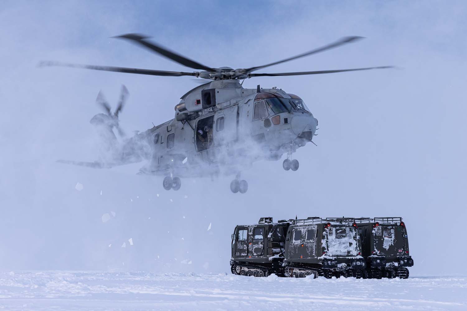 An 845 NAS Merlin stirs up snow on NATO exercises in Norway