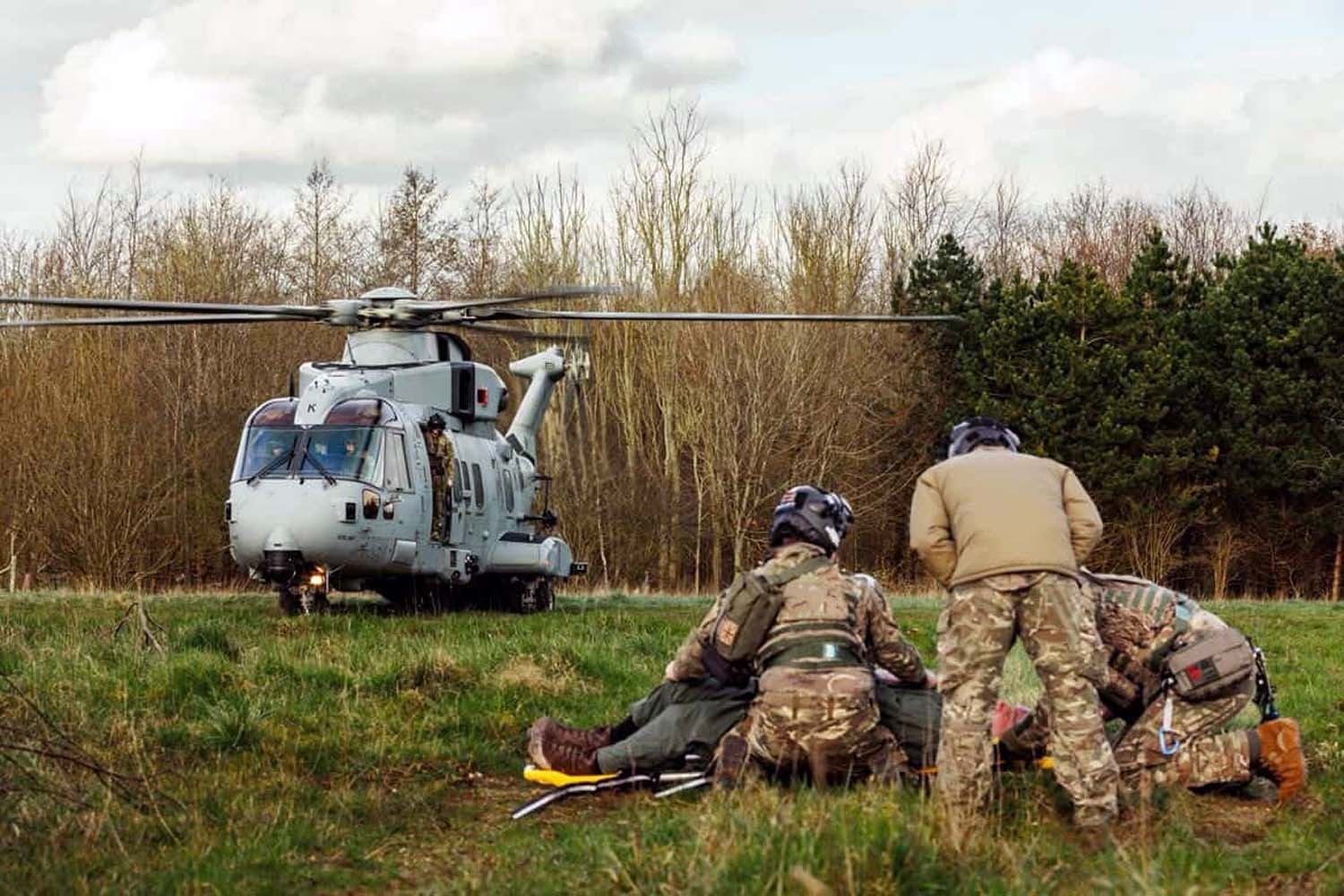 Aircrewman PO Oakes peers out of the Merlin's side door