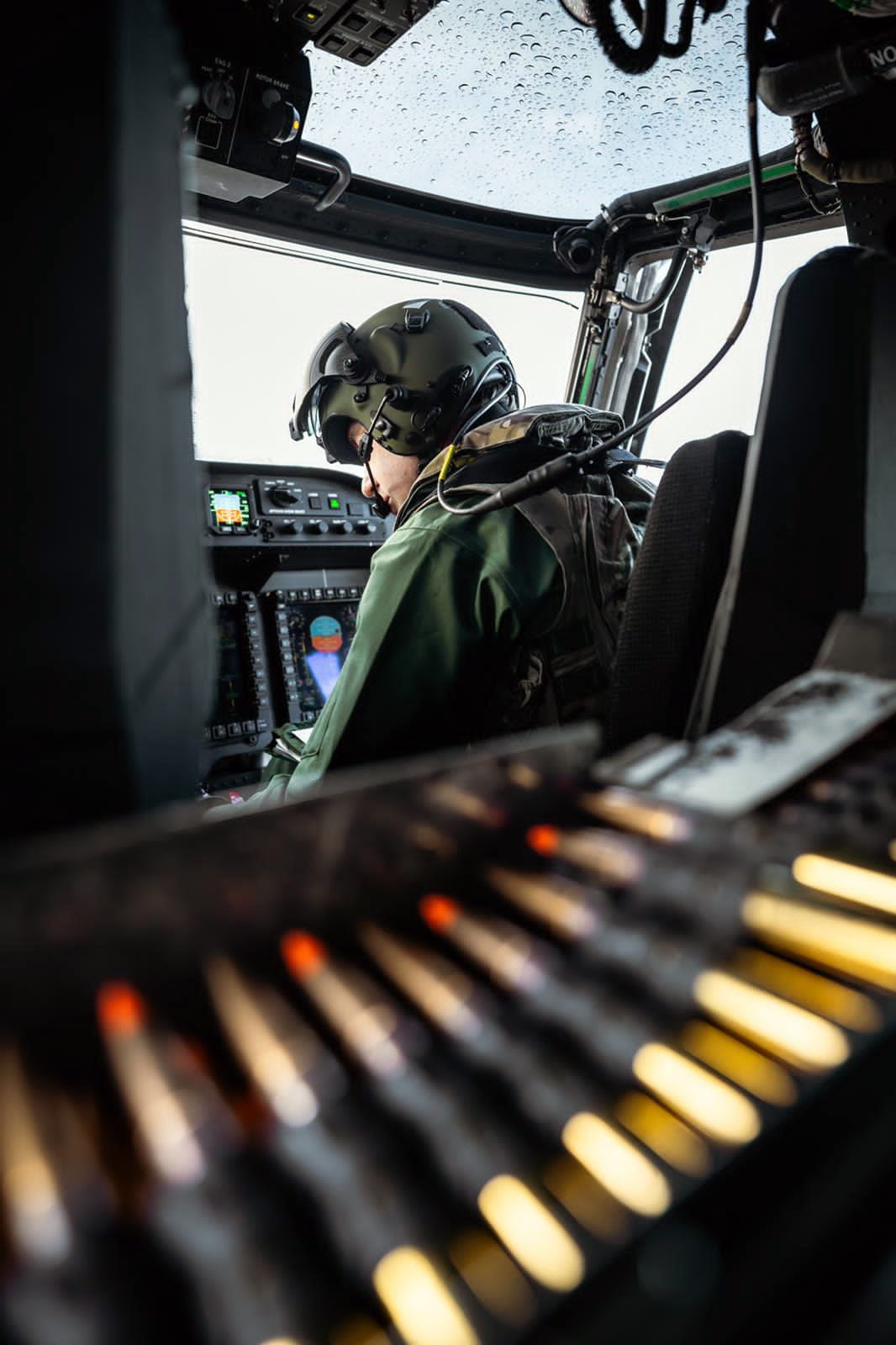 Pilot in Wildcat cockpit and ammo belt Pilot in Wildcat cockpit and ammo belt